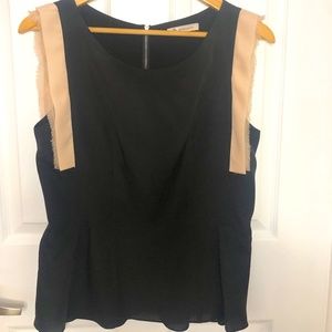 Sleeveless blouse with back zipper